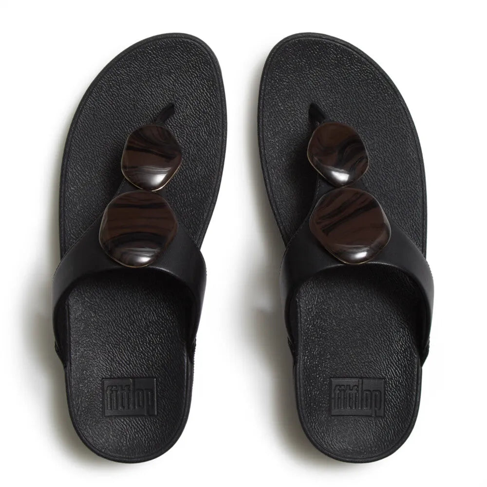 FitFlop Lulu marbled stone black T-strap ladies sandals with chunky stones, open toe, and slip-on design.
