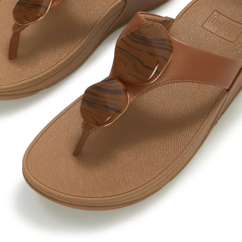 FitFlop Lulu Marbled Stone deep tan T-bar sandals for women, with large marbled brown and tan sunglasses accents.