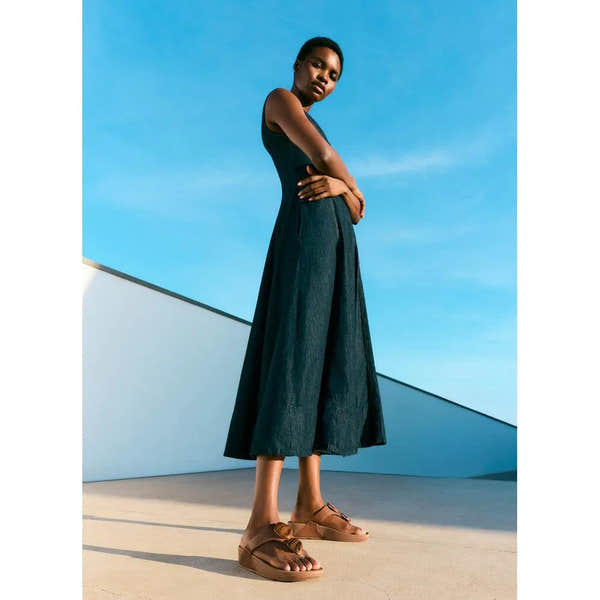 FitFlop Lulu Marbled Stone Deep Tan T-Bar Sandals on woman, stylish footwear with deep tan marbled design, casual summer shoes.