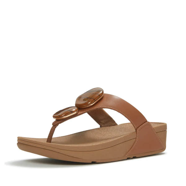 FitFlop Lulu marbled stone women's deep tan T-strap wedge sandals with decorative stone embellishments.