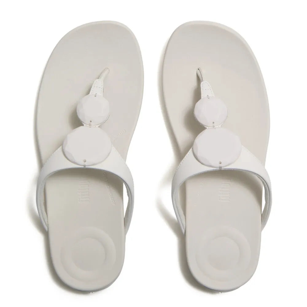 FitFlop Solay Glossy Disc T-strap Ladies Cream Sandals with shiny disc embellishments.