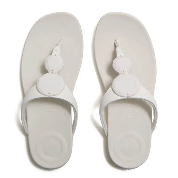FitFlop Solay Glossy Disc T-strap Ladies Cream Sandals with shiny disc embellishments.
