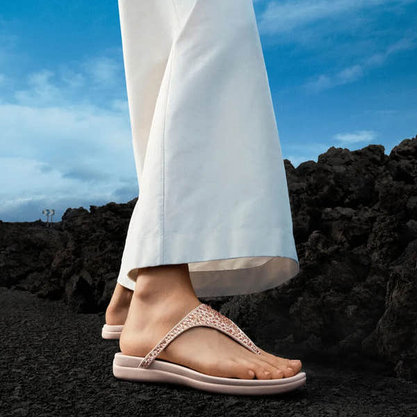 FitFlop Solay Women's Nude Rose T-Bar Crystals Sandals, trendy and comfortable, with mixed crystals and open-toe design.