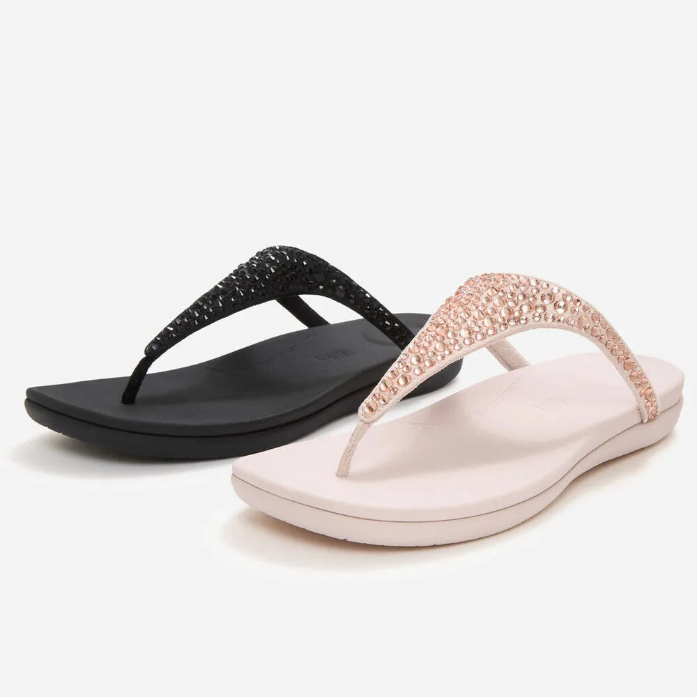 FitFlop Solay Ladies T-Bar Sandals with mixed crystals, one in nude pink with pink crystals, and one in black with black crystals.