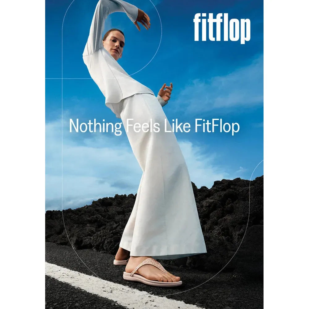 FitFlop Solay mixed-crystal nude rose T-strap sandals for women, stylish and comfortable footwear, featured in an outdoor setting.