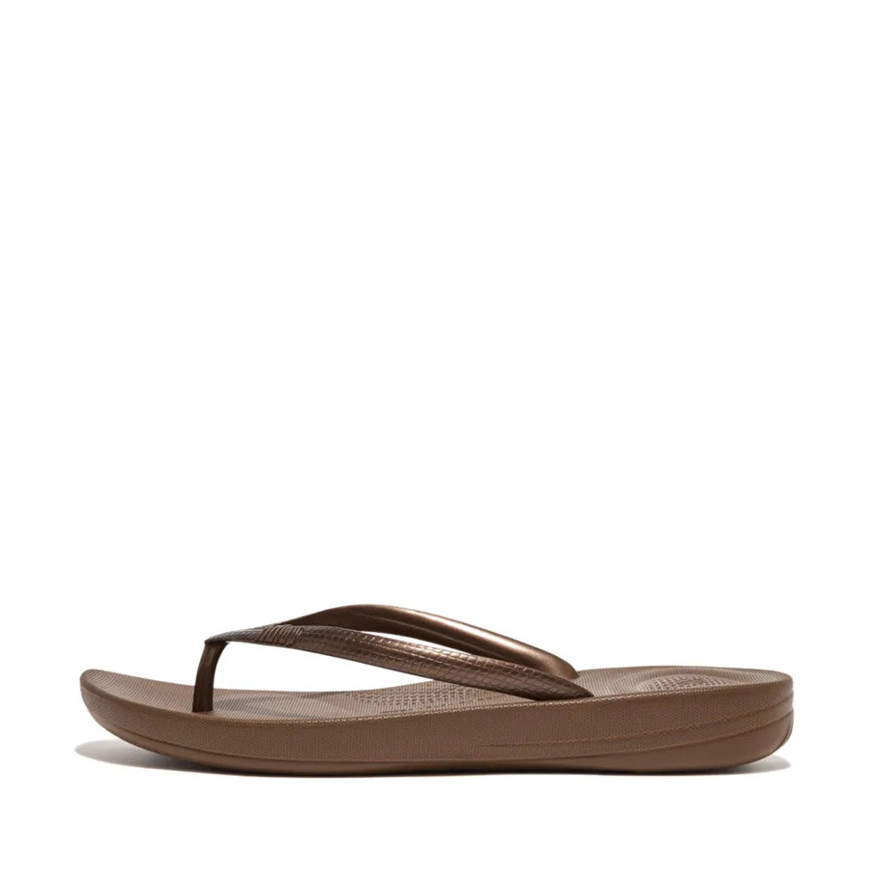 FitFlop E54-012 Iquishion Ladies Bronze T-Bar Sandals, bronze sandals with textured straps, cushioned sole, and T-bar design.