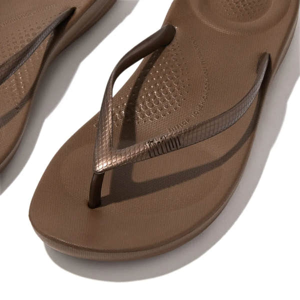 FitFlop E54-012 Iquishion women's bronze T-bar sandals with textured straps and cushioned footbed.