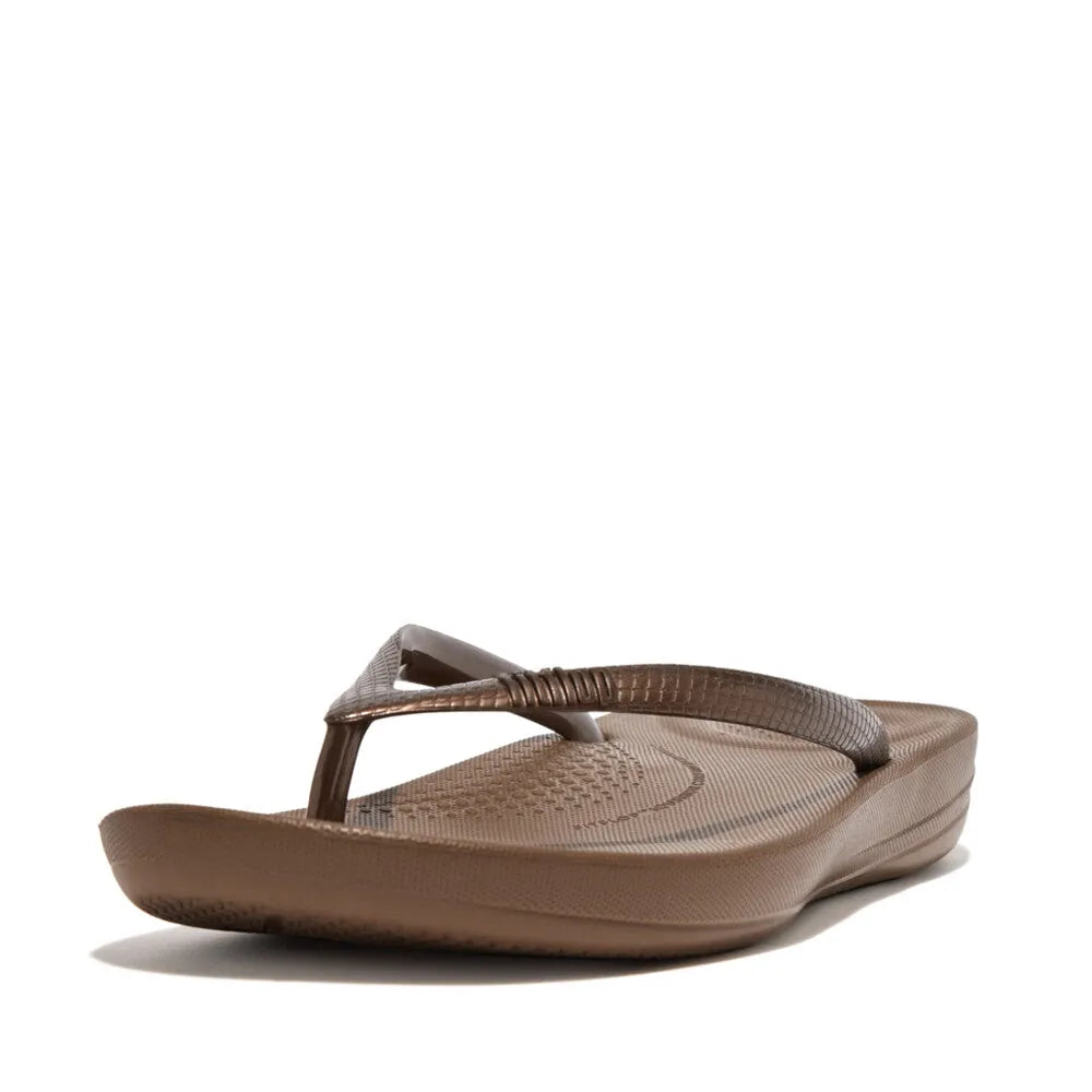 FitFlop E54-012 Iquishion Ladies Bronze T-Bar Sandals, lightweight flip-flops with metallic bronze finish and cushioned footbed.