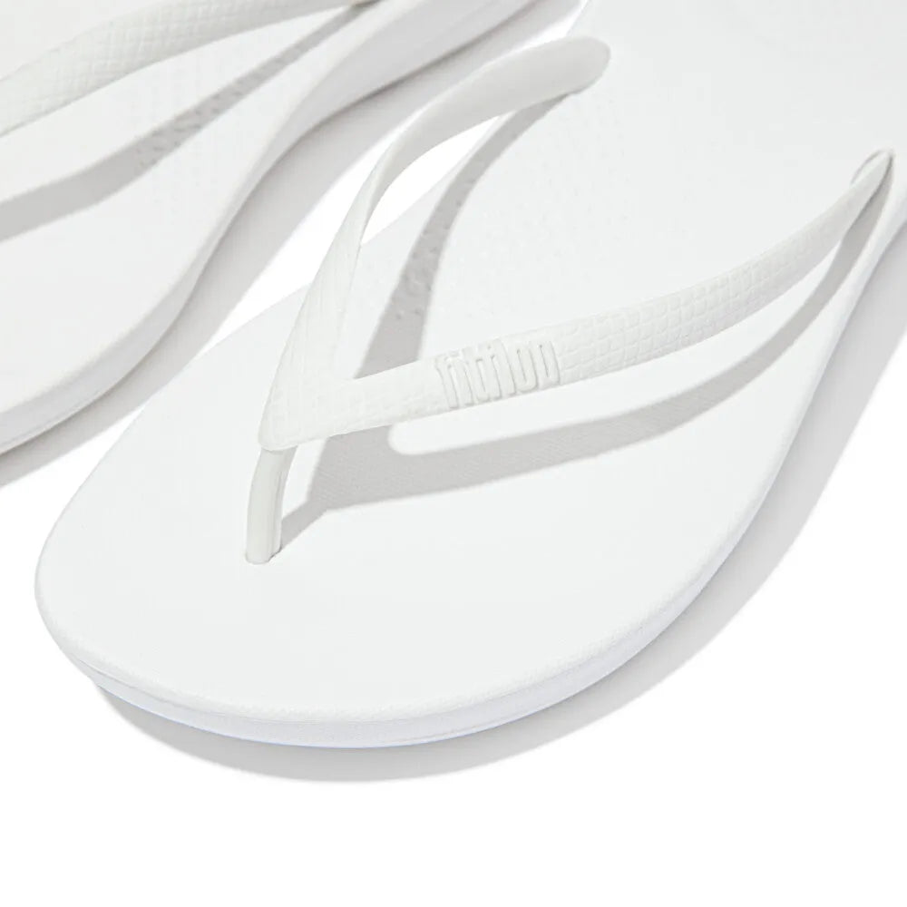 FitFlop E54-194 Iquishion ladies' white T-strap sandals, cushioned urban flip-flops with textured straps and flat sole.
