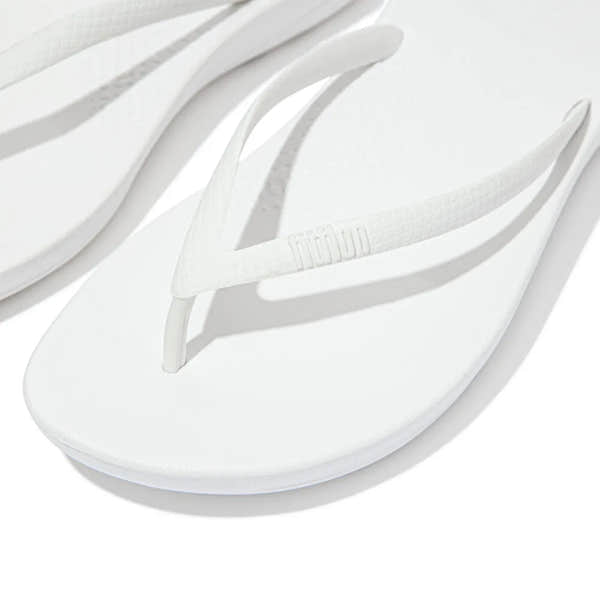FitFlop E54-194 Iquishion ladies' white T-strap sandals, cushioned urban flip-flops with textured straps and flat sole.