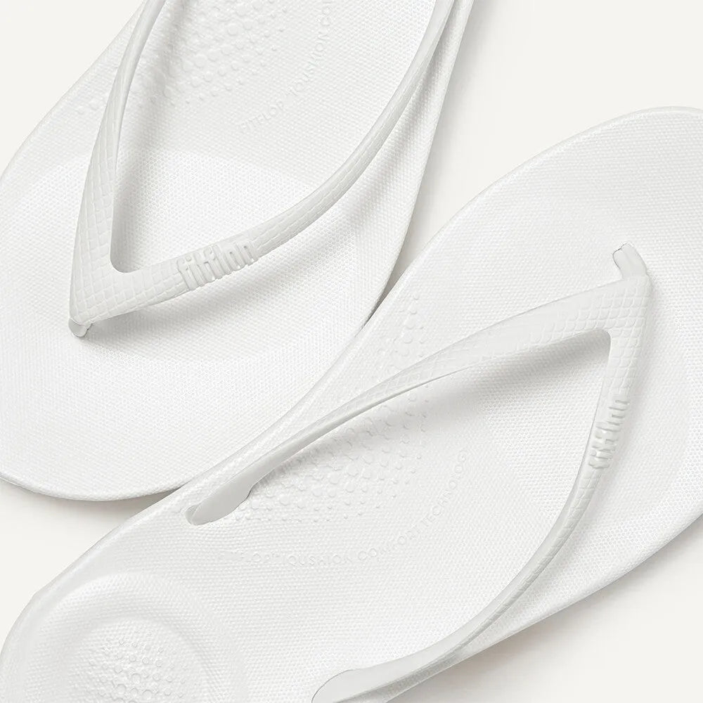 FitFlop E54-194 Iquishion ladies’ urban white T-strap sandals with textured footbed and slip-on style.