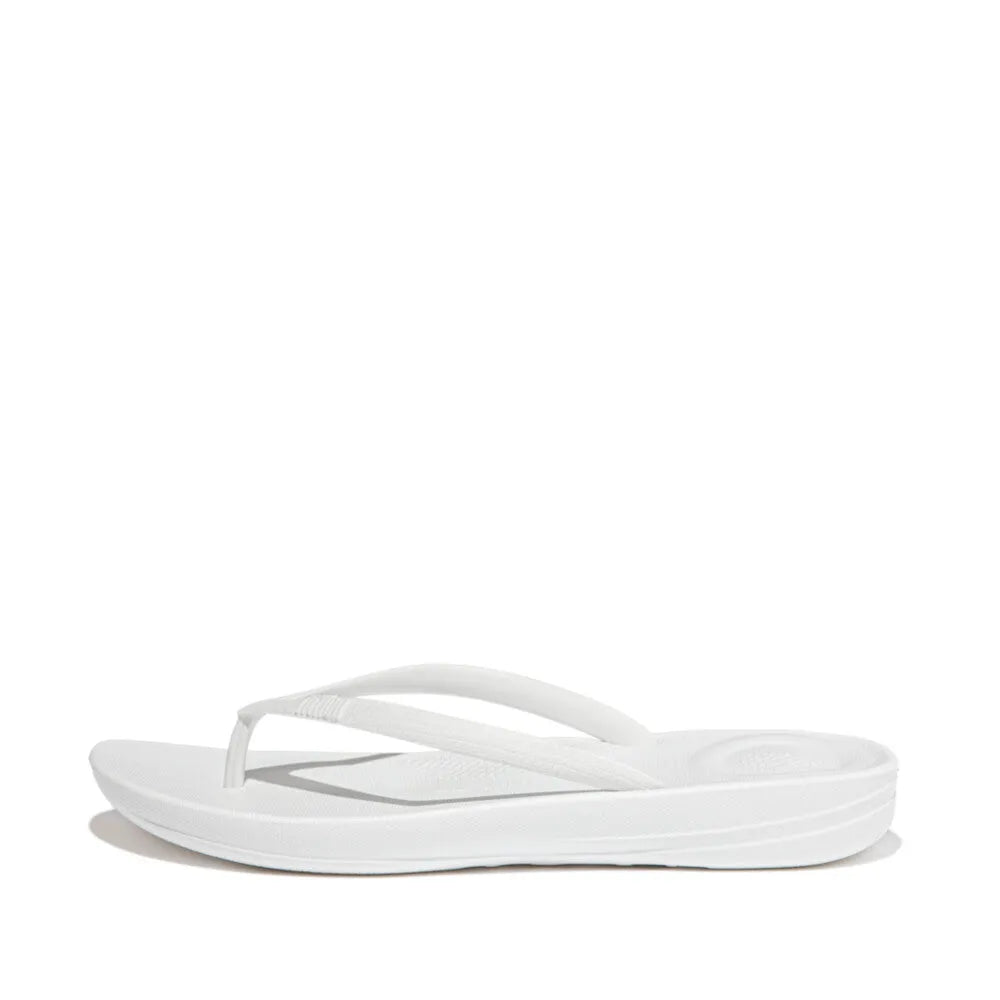 FitFlop Iquishion ladies white urban T-strap sandals with cushioned sole and minimalist design.