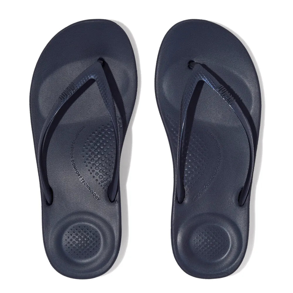 FitFlop E54-399 Iquishion Ladies Midnight Navy T-bar Sandals, cushioned thong-style sandals with textured footbed and slip-resistant sole.