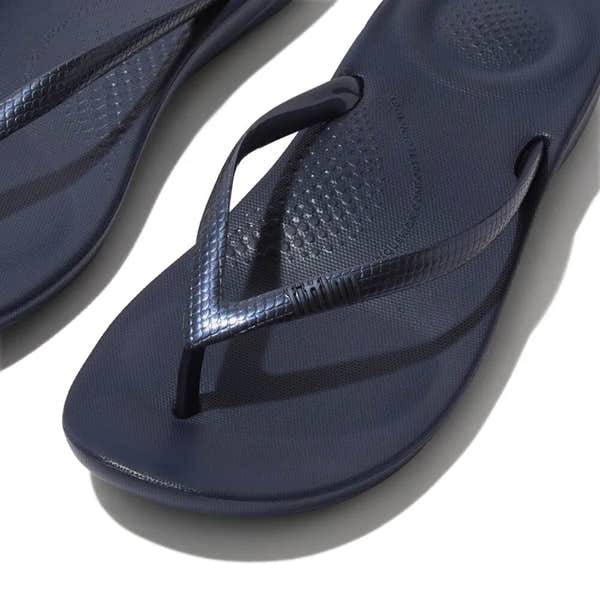 FitFlop E54-399 Iquishion women's navy T-bar sandals with textured straps and cushioned footbed.