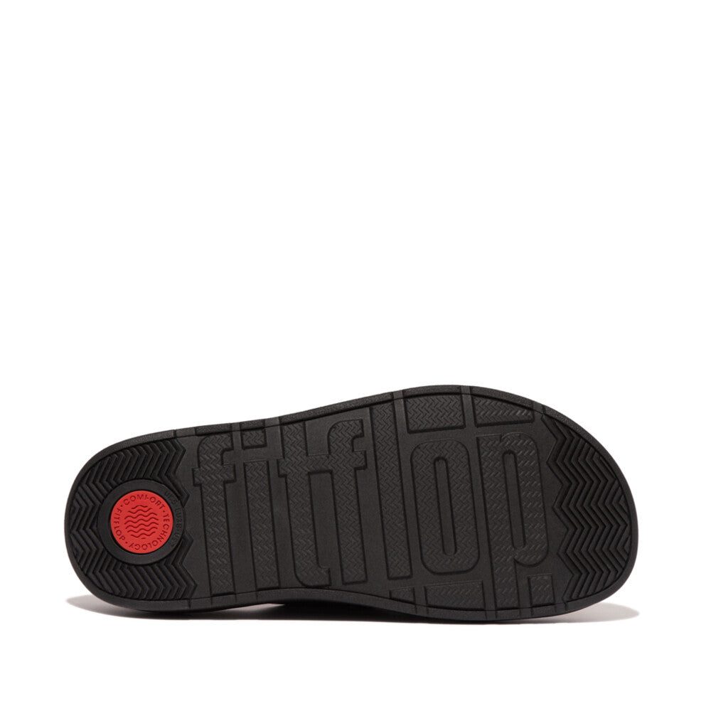 FitFlop HE8-001 Gen-FF women's wide black leather buckle sandals with cushioned sole and adjustable buckle strap.