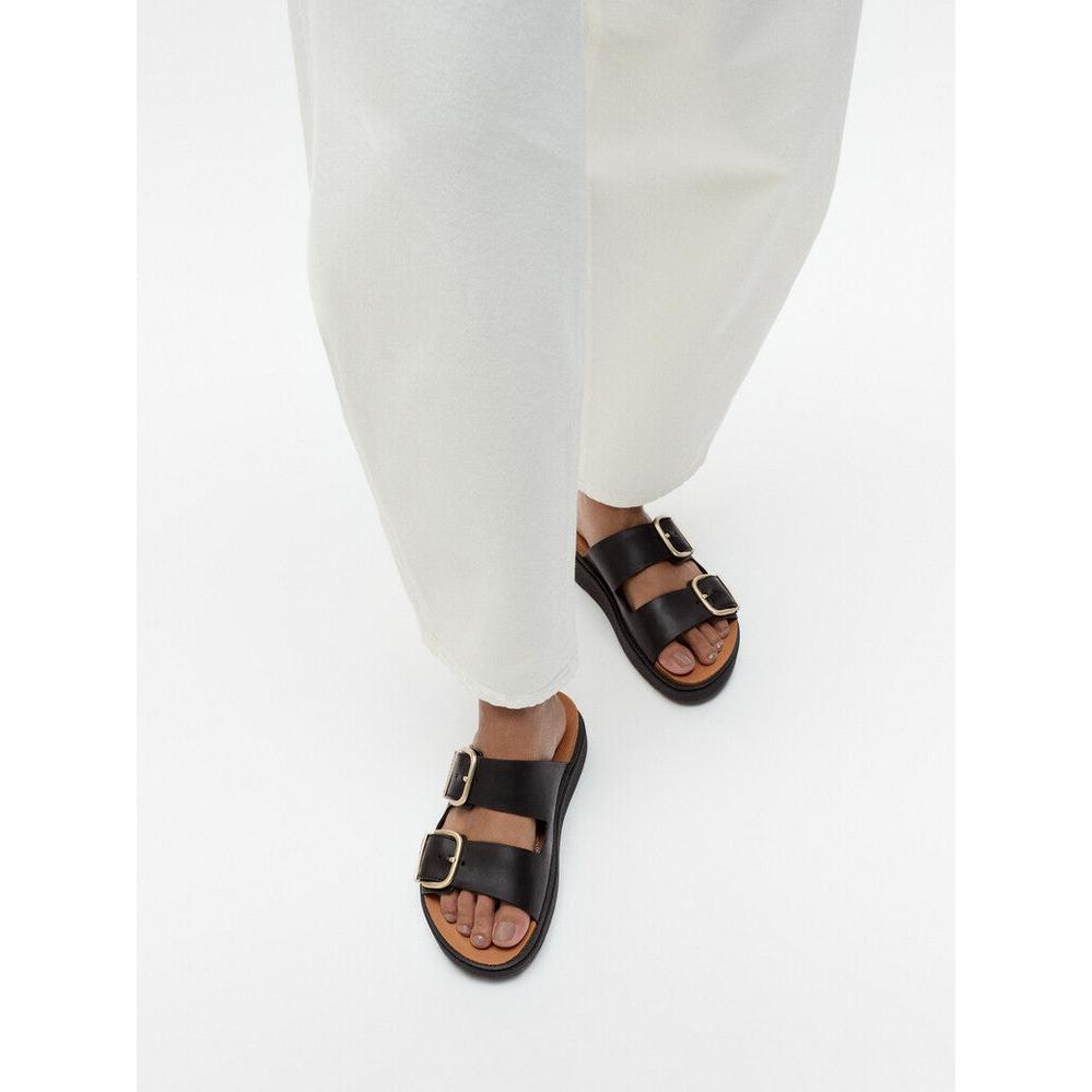 FitFlop HE8-001 Gen-FF women's wide black leather buckle slide sandals with dual straps and gold buckles.