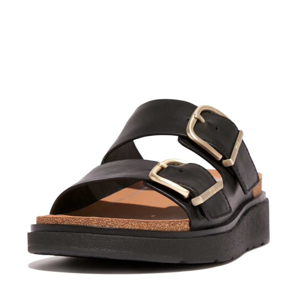 FitFlop HE8-001 Gen-FF women's wide black leather buckle sandal with cushioned insole and thick platform sole.