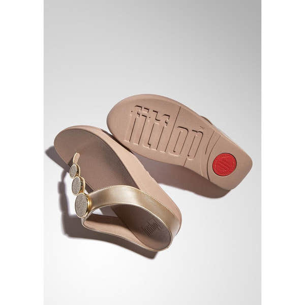 FitFlop HJ1-C22 Halo Bead women’s metallic latte beige slip-on sandals with decorative circular embellishments.