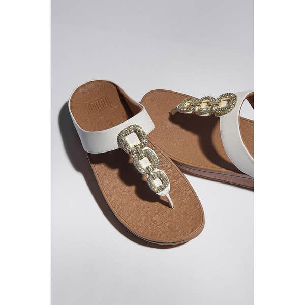 FitFlop HX2-194 Fino Crystal white leather slip-on sandals with jeweled chain embellishment, cushioned footbed, and flat sole.