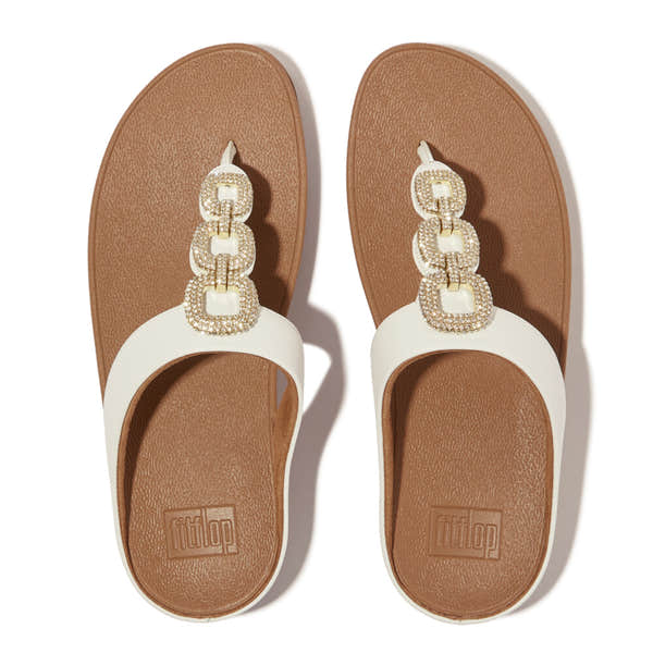 FitFlop HX2-194 Fino Crystal women's white leather slip-on sandals with jeweled chain embellishment.
