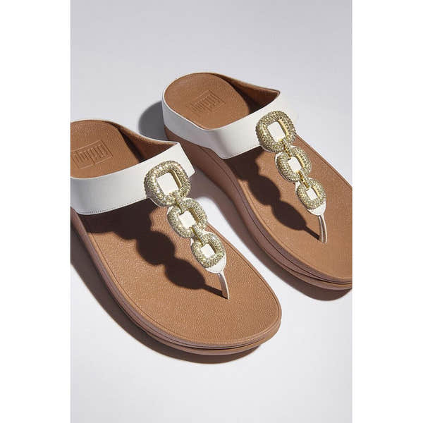 FitFlop HX2-194 Fino Crystal women's white leather slip-on sandals with decorative chain detail.