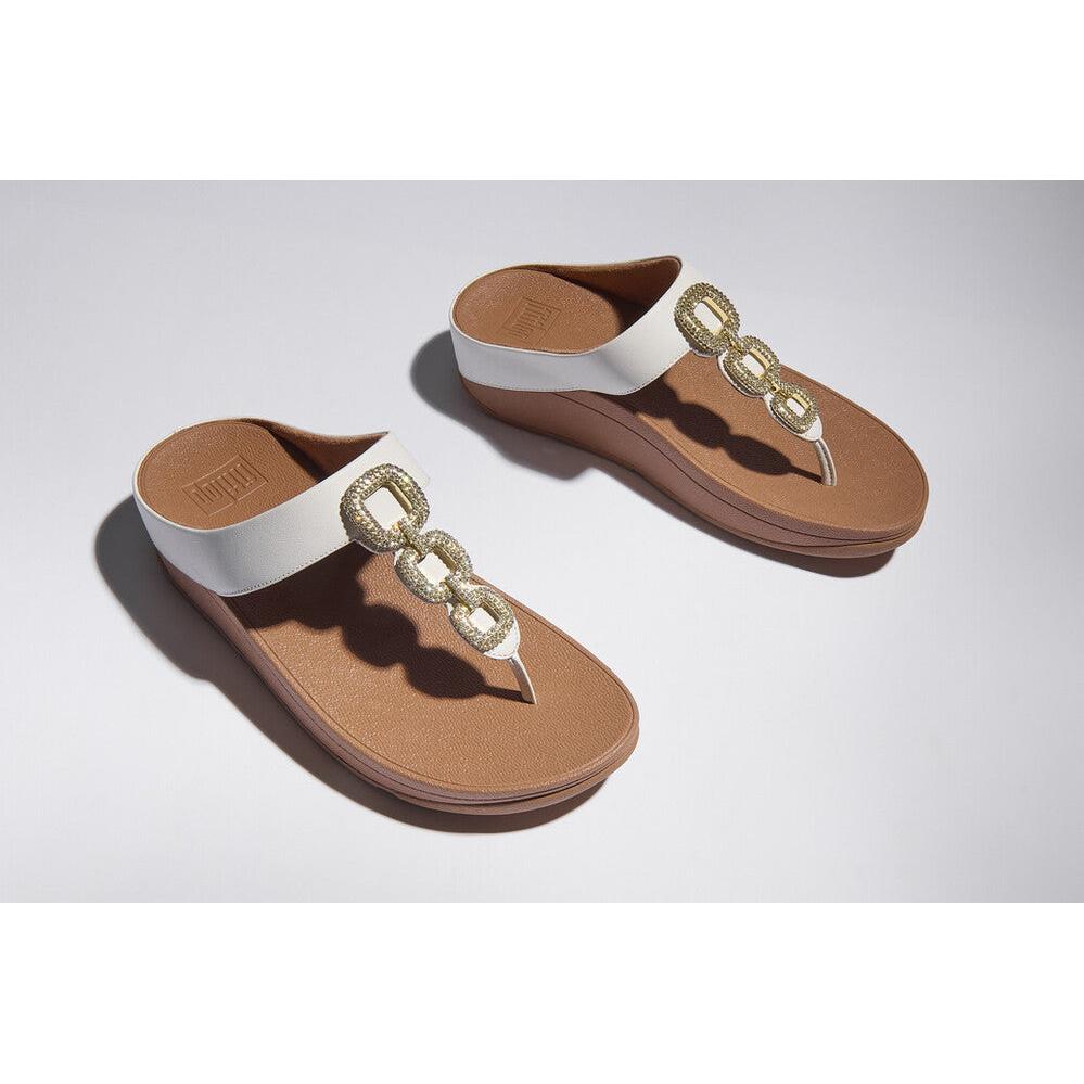 FitFlop HX2-194 Fino Crystal women's white leather slip-on sandals with jeweled chain detail.