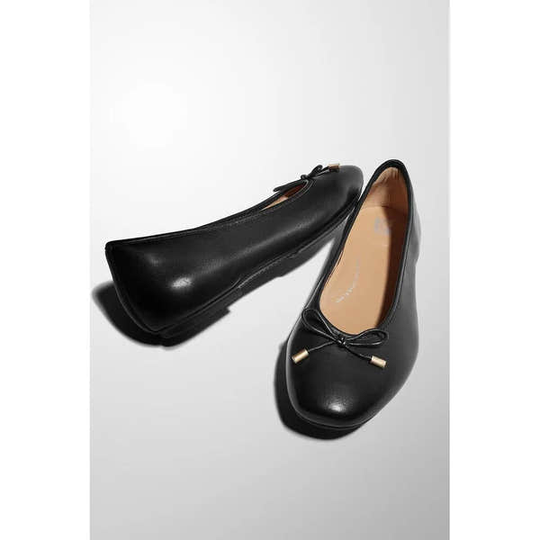Black leather slip-on ballet flats with bow detail, designed for women, from FitFlop HX8-001 Delicato Bow collection.
