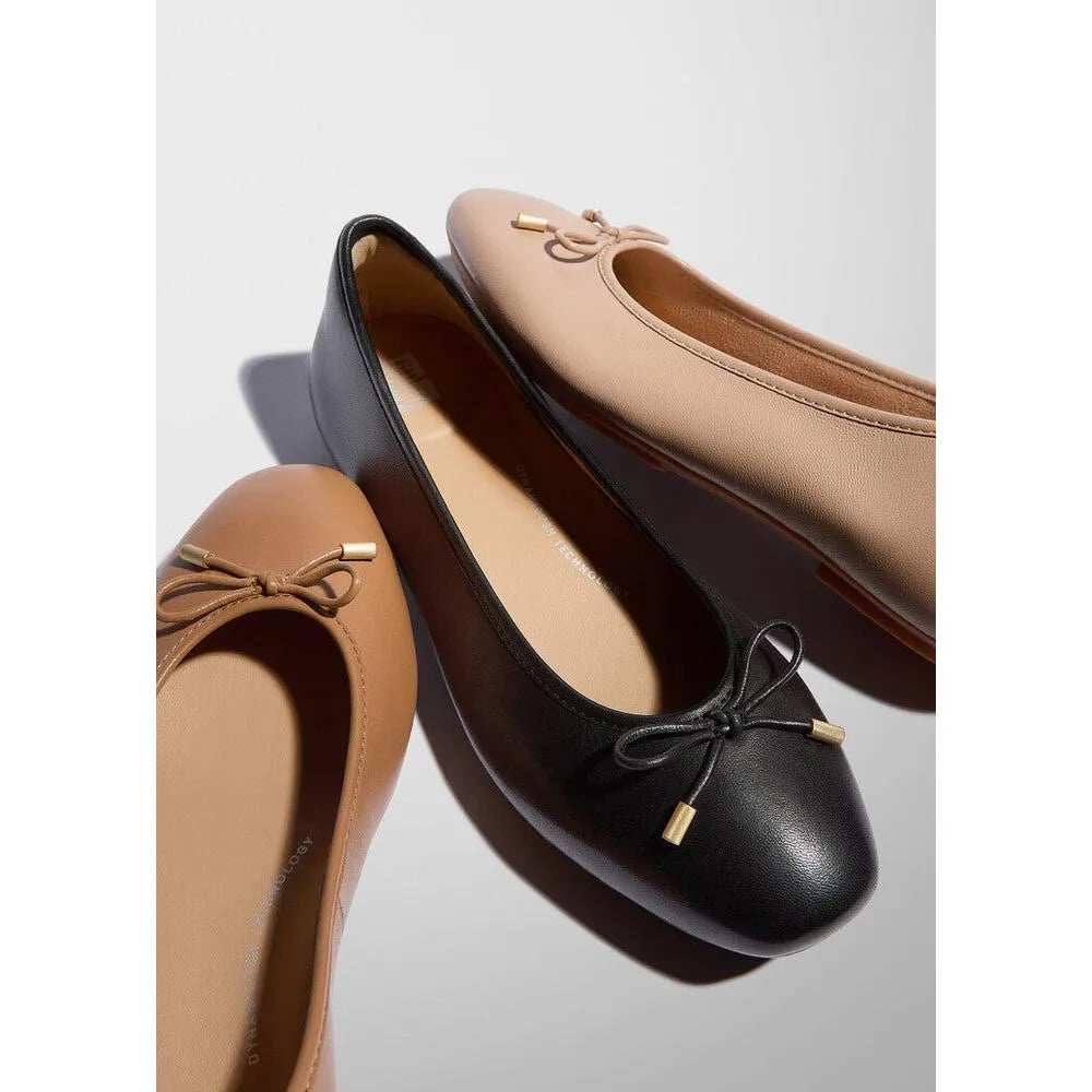 FitFlop HX8-001 Delicato Bow ladies' black, beige, and tan leather slip-on ballet flats with bow detail.