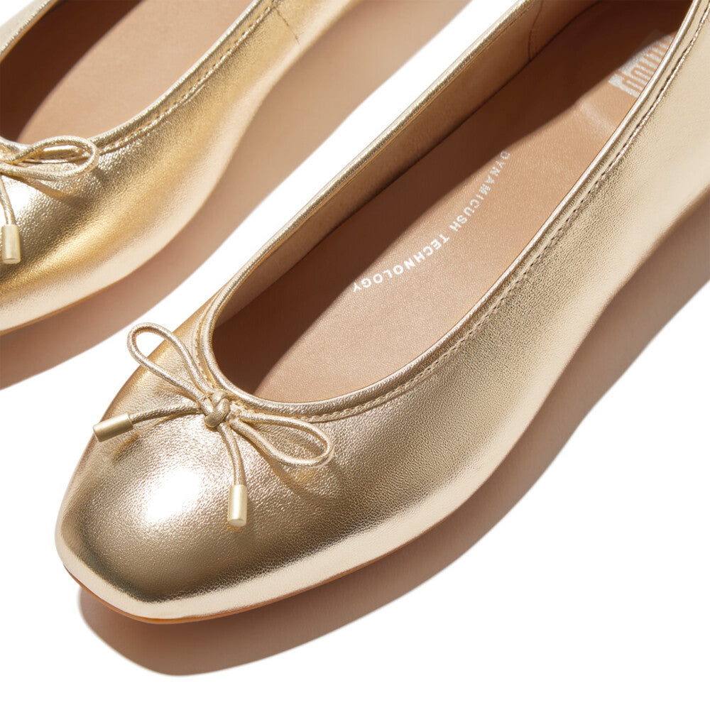 FitFlop IH2-675 Delicato Bow women's narrow platinum leather slip-on ballet flats with bow detail.