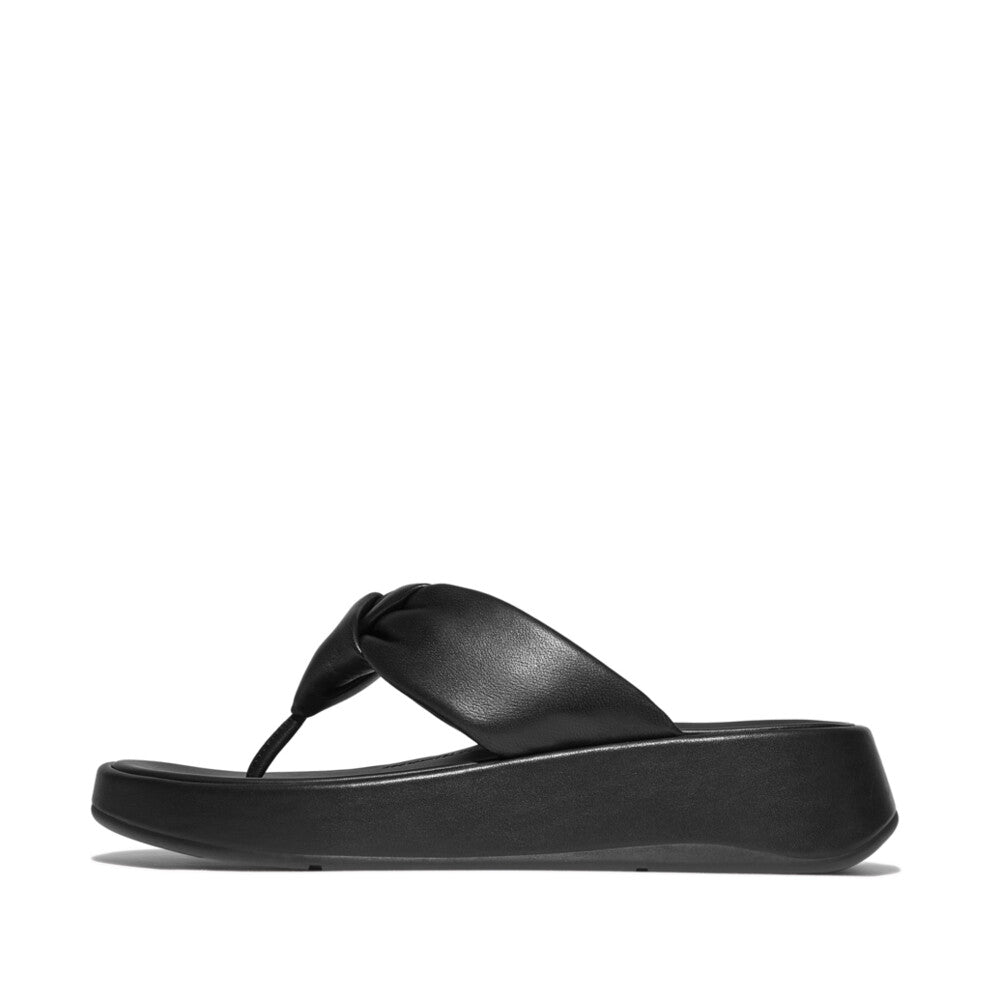 FitFlop F-Mode Knot women's black leather slip-on sandals with padded straps and cushioned platform sole.