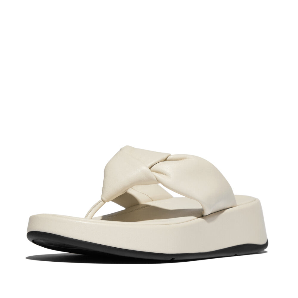 FitFlop IY1-A99 F-Mode Knot beige leather slip-on sandals with twisted strap, platform sole, and cushioned footbed.