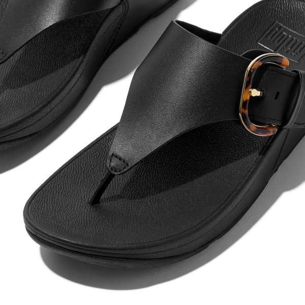 FitFlop Lulu Resin women's black leather slip-on sandals with buckle detail.