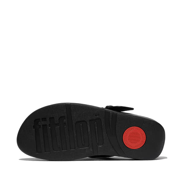 FitFlop Lulu Resin women's black leather slip-on sandals with cushioned sole and textured outsole.