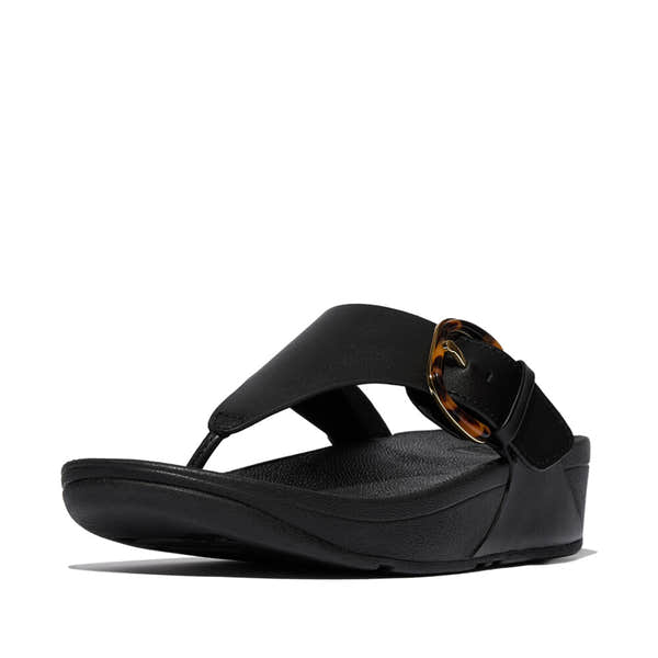 FitFlop Lulu Resin black leather slip-on sandal with tortoise shell buckle, ergonomic footbed, and open toe design.