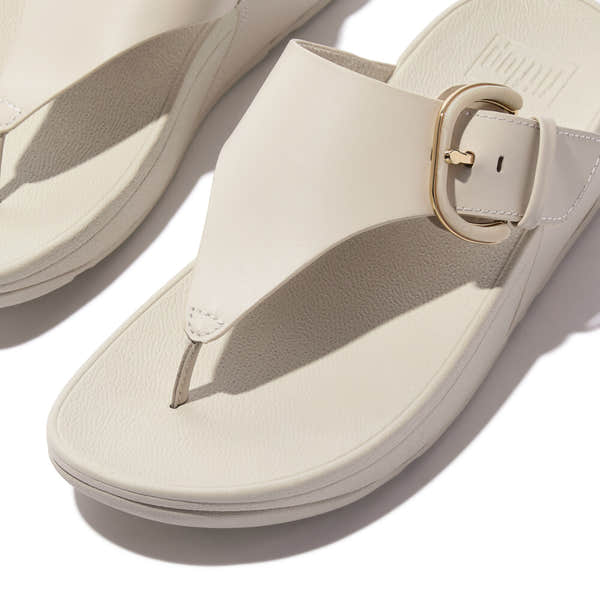 FitFlop Lulu Resin beige leather slip-on sandals with buckle detail for women.