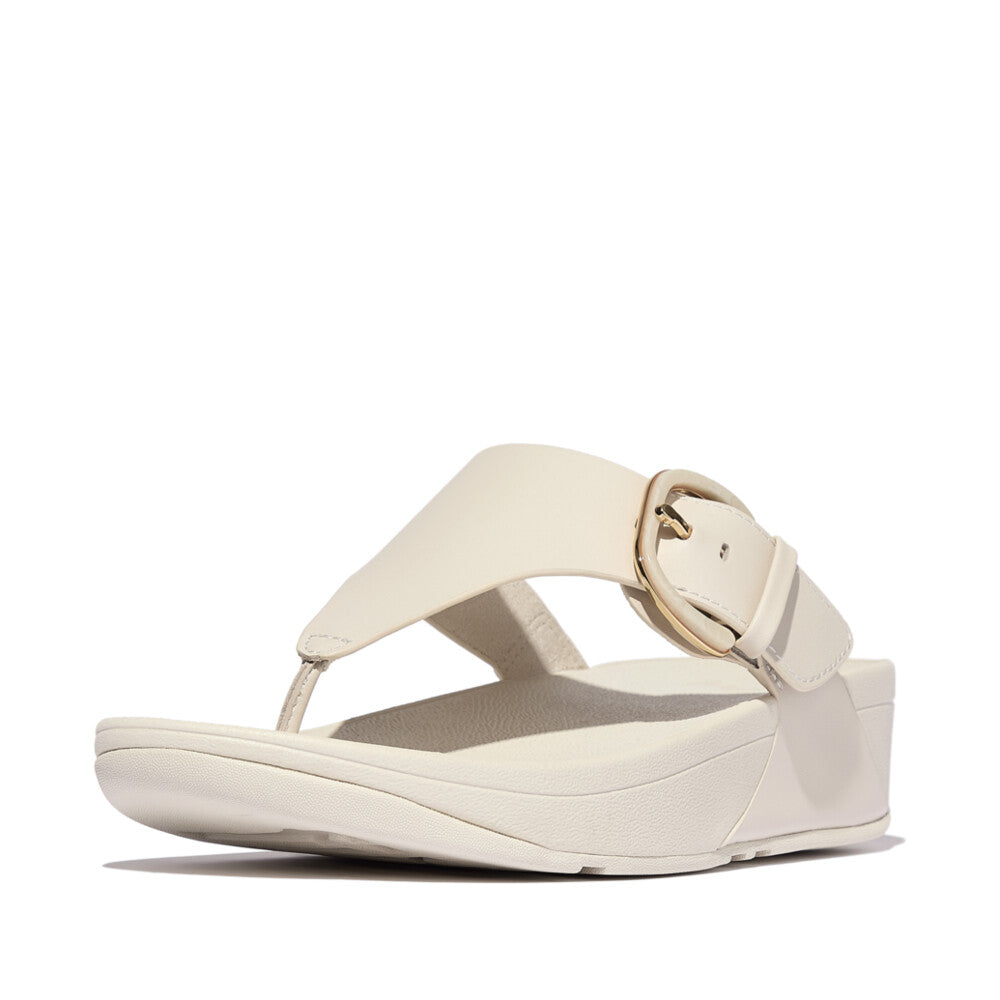FitFlop Lulu Resin beige leather slip-on wedge sandals with adjustable buckle and cushioned sole.