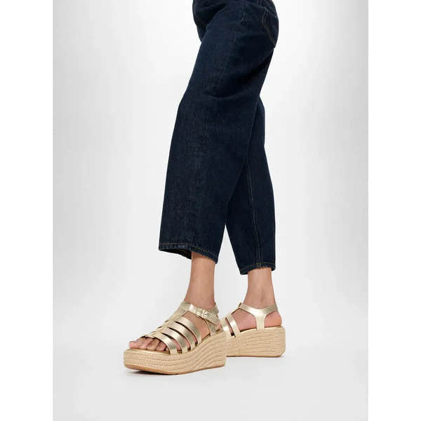 FitFlop women's platform espadrille sandals with platinum leather T-strap and cork wedge sole.