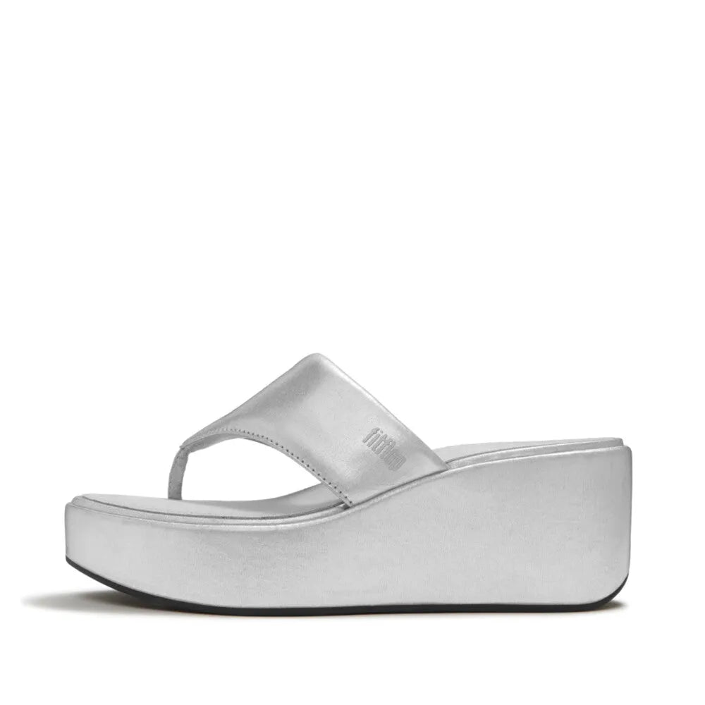 FitFlop JF8-011 platform wedge sandals for women in silver textile with T-strap design and chunky sole.