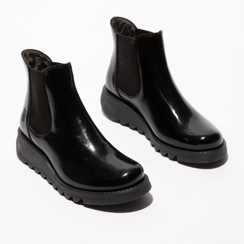Fly SALV195FLY women's black patent leather ankle pull-on boots with a sleek finish and chunky sole.