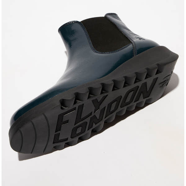 Fly SALV195FLY ladies navy patent leather pull-on ankle boots with rugged sole and branding outsole.