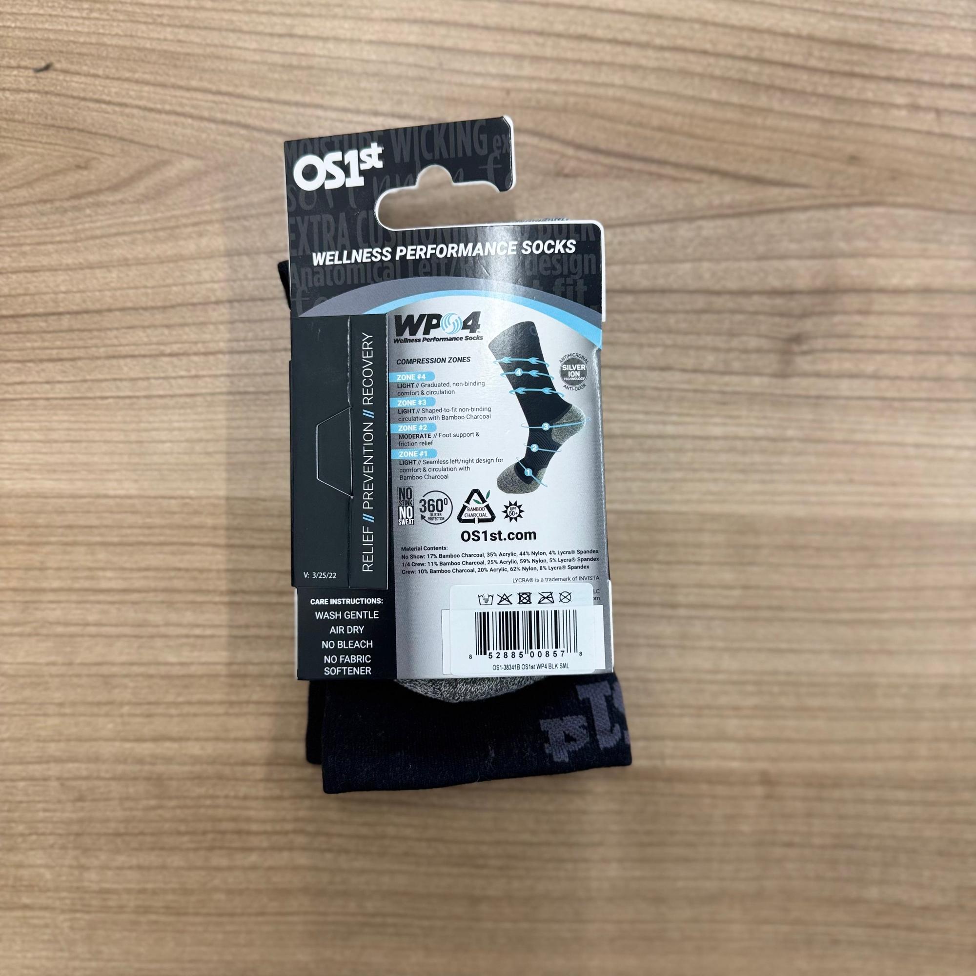FootBalance OS1st WP4 black wellness socks with bamboo charcoal, compression zones, and anti-odor features, designed for comfort and support.