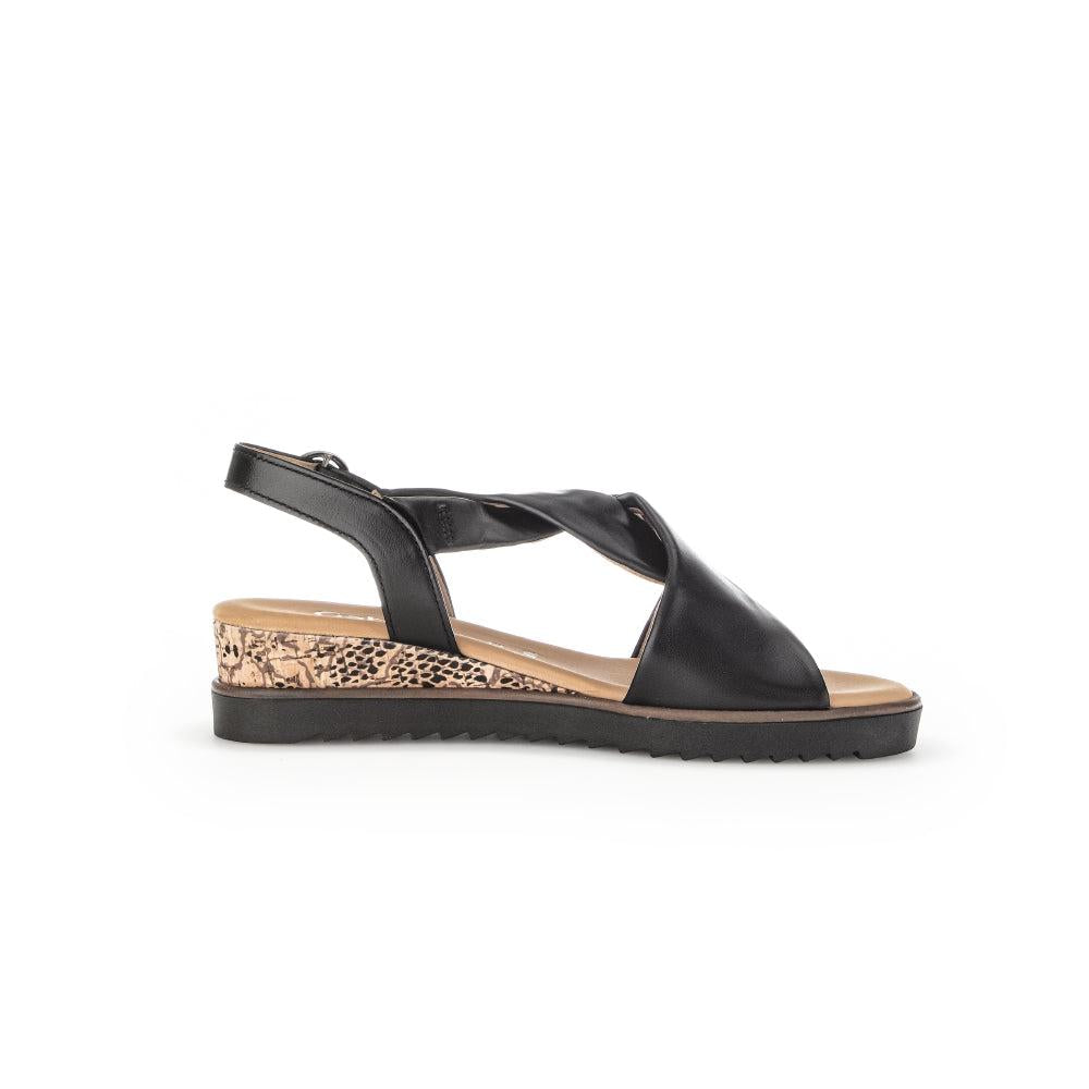 Gabor 62.751.27 black leather buckle sandals with a snakeskin-patterned wedge sole and open toe design.