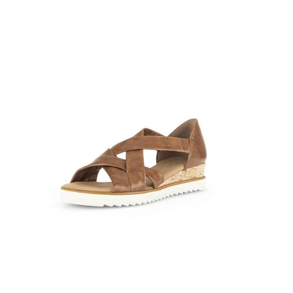 Gabor women's brown leather slip-on sandals with crisscross straps and wedge cork heel, featuring a white rubber sole.