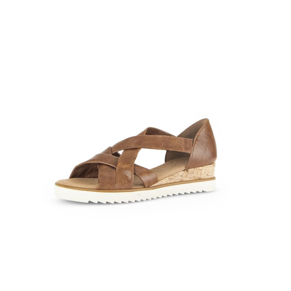 Gabor women's brown leather slip-on sandals with crisscross straps, cork wedge heel, and white ridged sole.