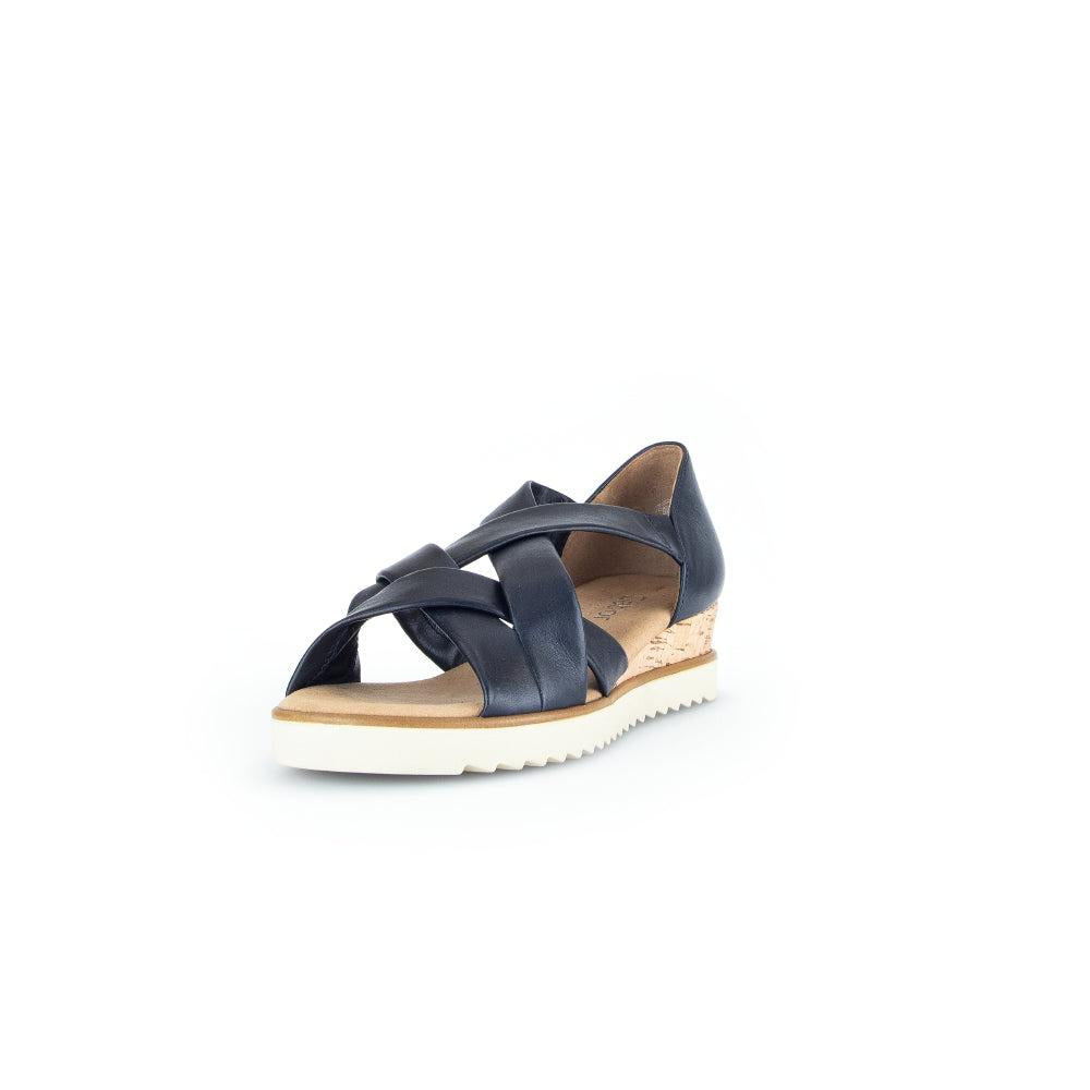 Gabor women's navy leather slip-on wedge sandals with crisscross straps, cork heel, and white outsole for comfort and style.