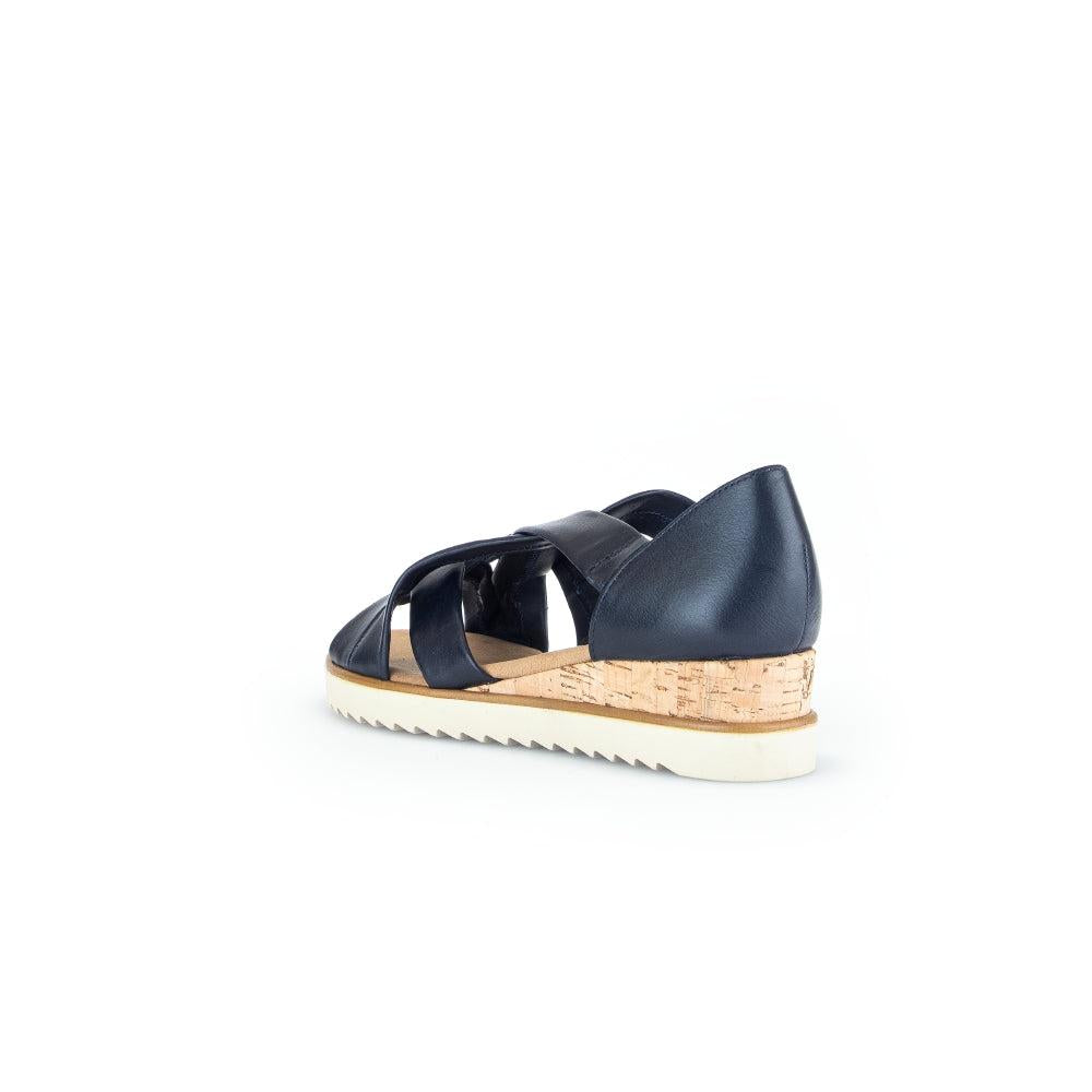 Gabor women's navy leather slip-on sandals with cork wedge heel and white rubber sole.