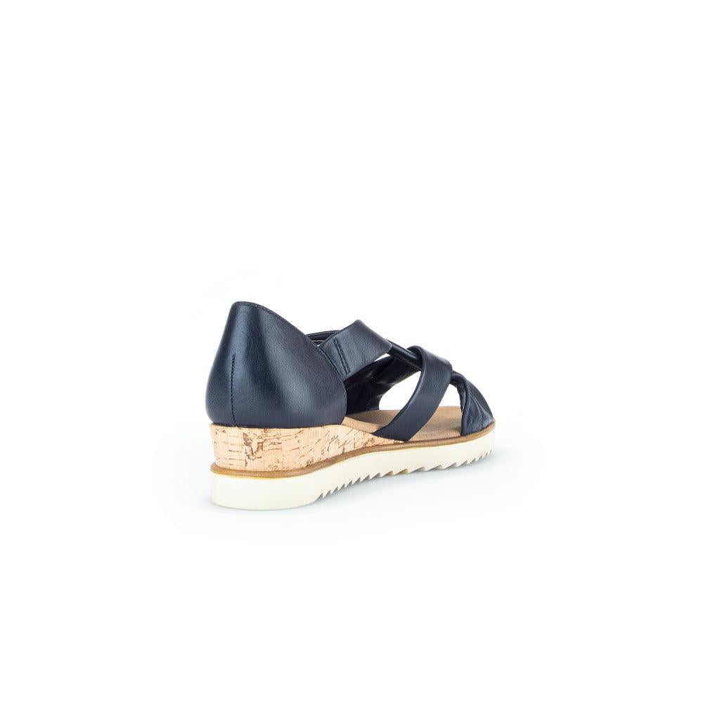 Gabor women's navy leather slip-on sandals with cork wedge heel and white rubber sole.