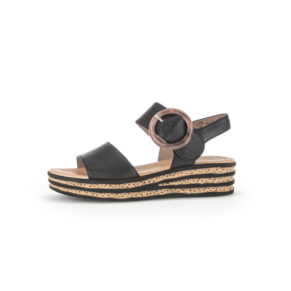 Gabor André women's black leather touch fastening sandals with layered cork wedge sole and round buckle detail.