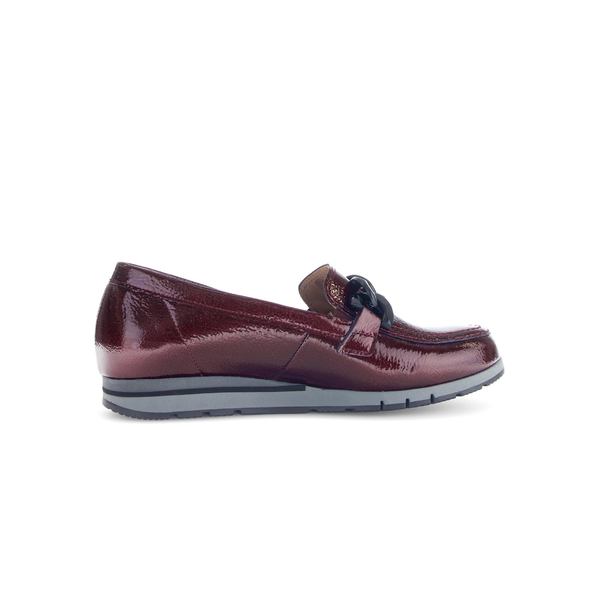 Gabor burgundy red and black grained patent leather slip-on loafers with a decorative bow detail and cushioned rubber sole.