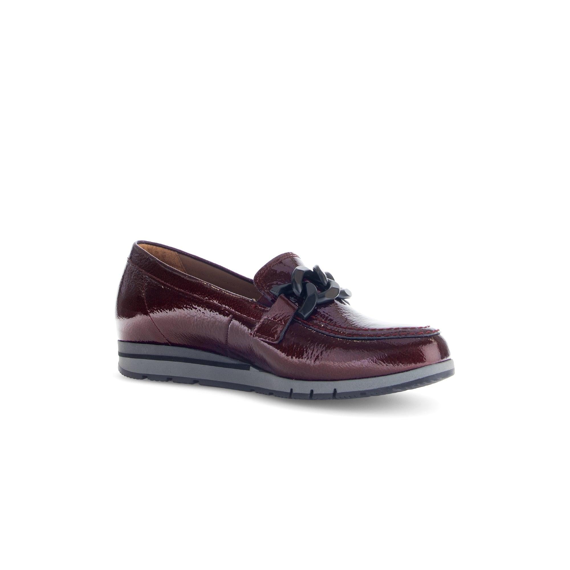 Gabor women’s burgundy red and black grained patent leather slip-on loafers with black chain detail.